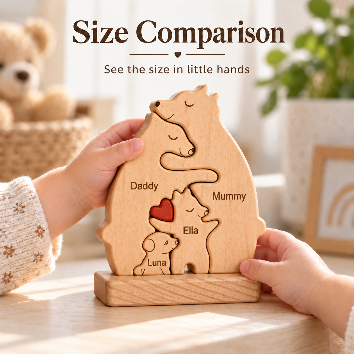 A wooden animal silhouette puzzle stand with engraved names and a red heart, held by two children's hands on a tabletop. Text at the top reads 'Size Comparison' with the subtitle 'See the size in little hands.