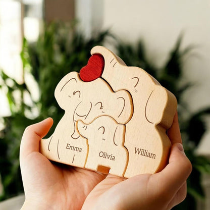 Close up of custom engraved names on wooden elephant family figurines