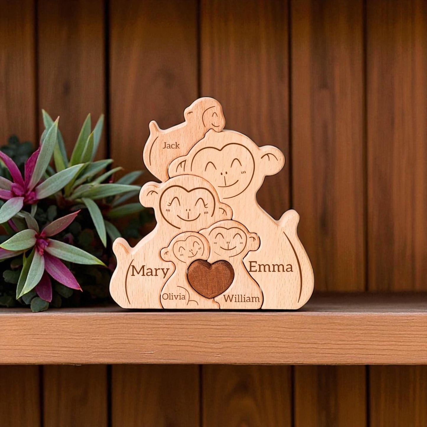 Wooden family figurine with engraved names on a wooden shelf.