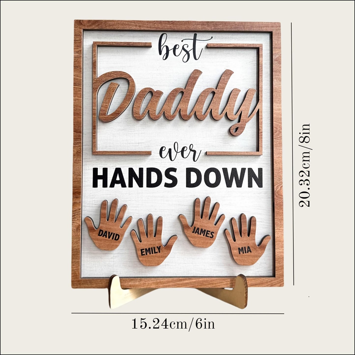 Wooden plaque with cut-out letters spelling 'best Daddy ever HANDS DOWN' and cut-out hand shapes with names below on a white background.