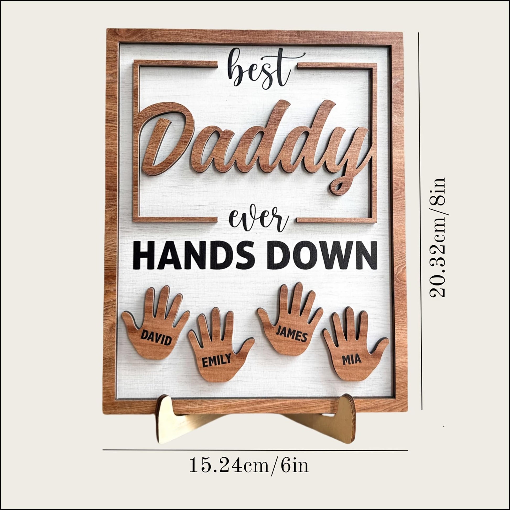 Wooden plaque with cut-out letters spelling 'best Daddy ever HANDS DOWN' and cut-out hand shapes with names below on a white background.