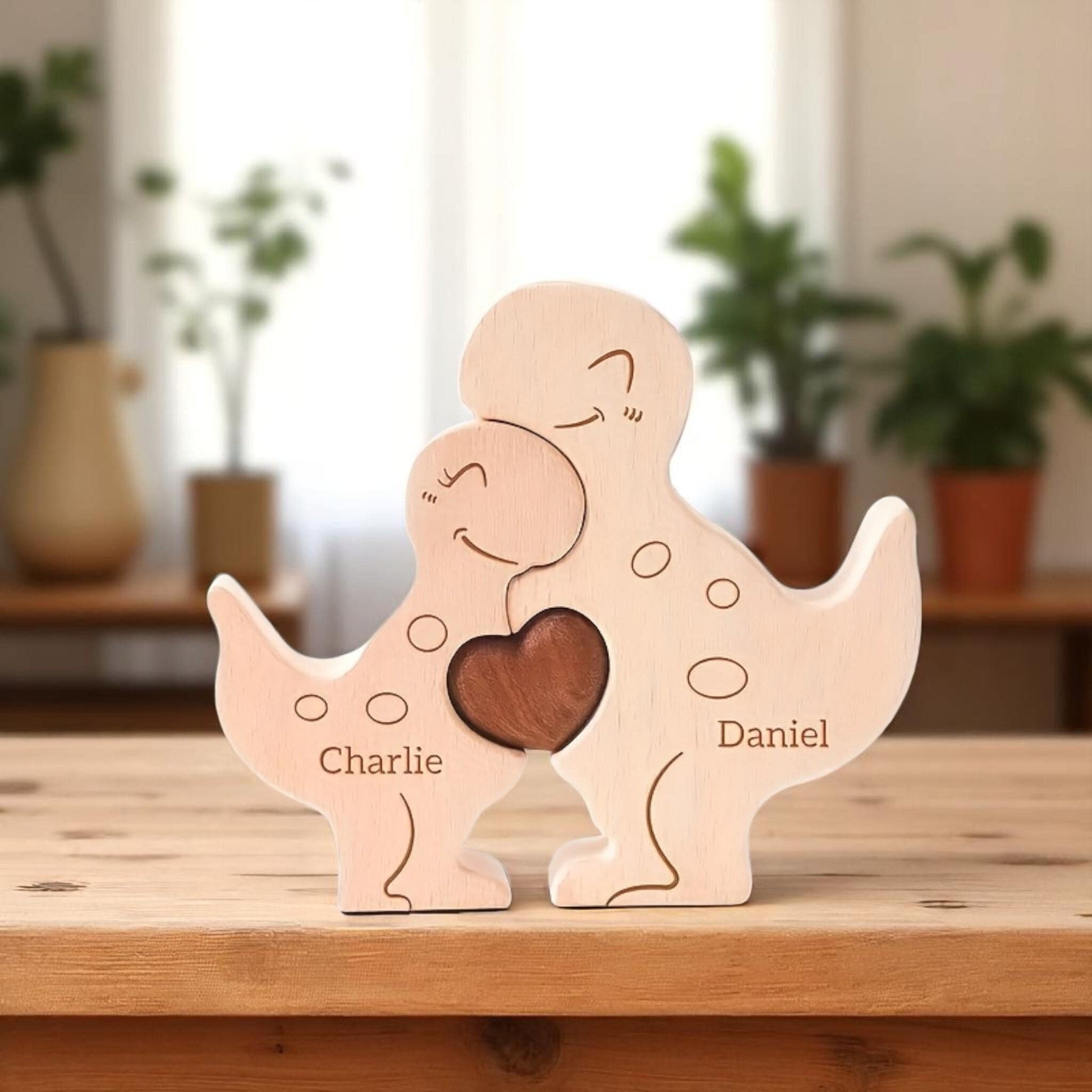Personalised dinosaur family wooden puzzle for 2 people with custom engraved names, set against a blurred indoor background with plants.