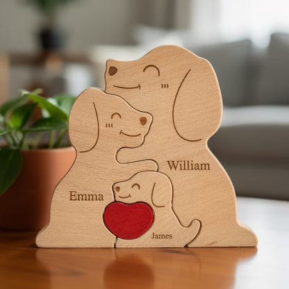 Wooden family puzzle of dog figurines with three pieces and a red heart, standing on a table with plants in the background, All names are custom engraved for the family member names.