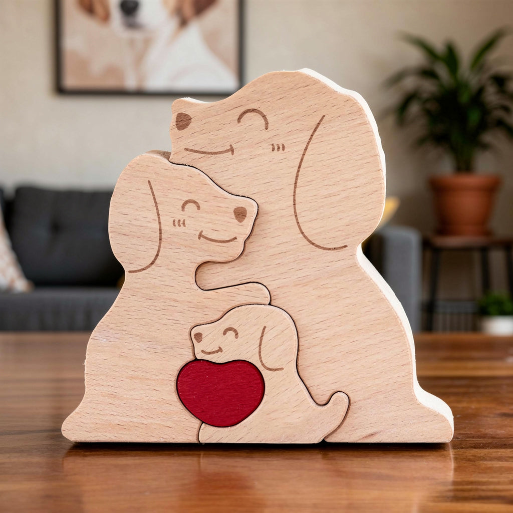 Wooden family puzzle of dog figurines with three pieces and a red heart, standing on a table with plants in the background, All names are engraved for the family member names.