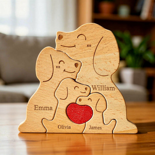 Wooden family puzzle of dog figurines with four pieces and a red heart, standing on a table with plants in the background.