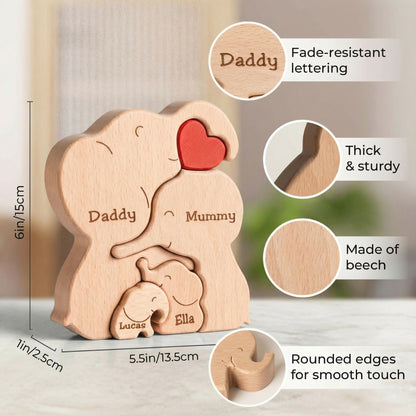 Size guide for a personalised wooden elephant family puzzle of 4 with custom engraved names, handcrafted beech wood family keepsake and home décor. The puzzle features a red heart and is made of light-coloured wood. A unique and personalised gift.