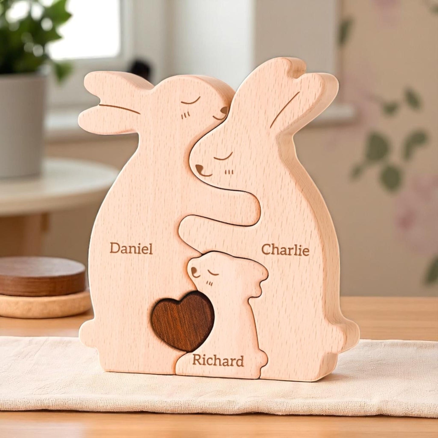Handmade bunny family puzzle showing trio of family members with engraving on  a wood shelf as decor