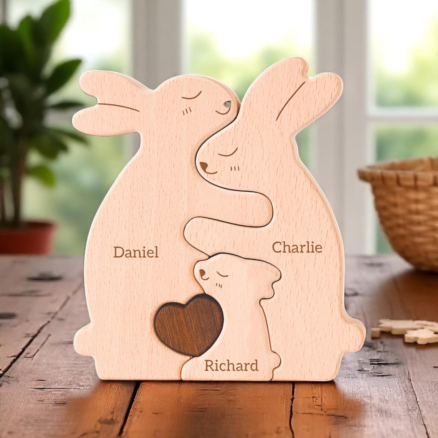 Handmade bunny family puzzle showing trio of family members with engraving, on a wooden table.