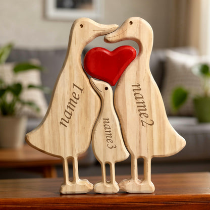 Handmade duck family keepsake showing family of three with custom engraving on a wood shelf.