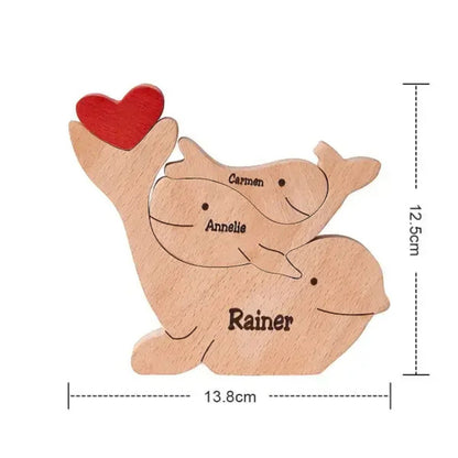 Handmade whale family keepsake showing family of three with engraving, with measurements on a white background