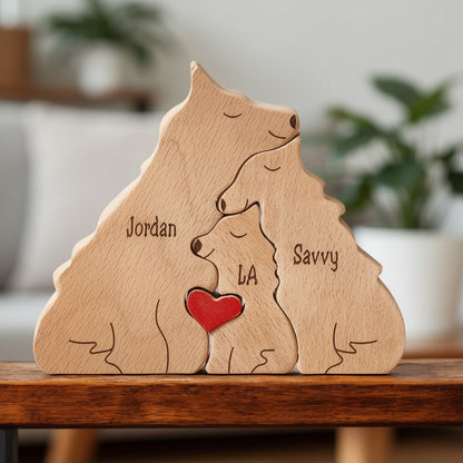 Handmade wolf family keepsake showing three person family with engraving, on a wooden surface.