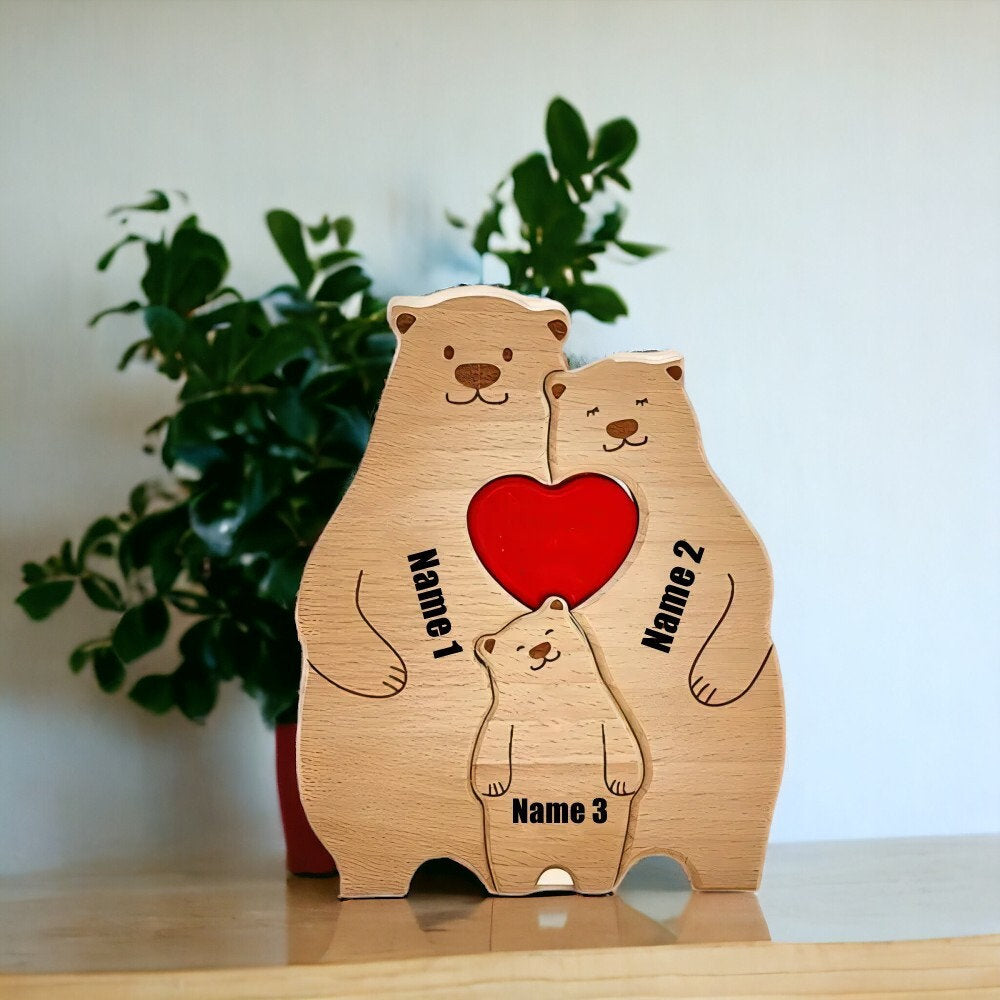 Personalised bear family wooden ornament for 3 people with custom engraved names with a plant in the background.