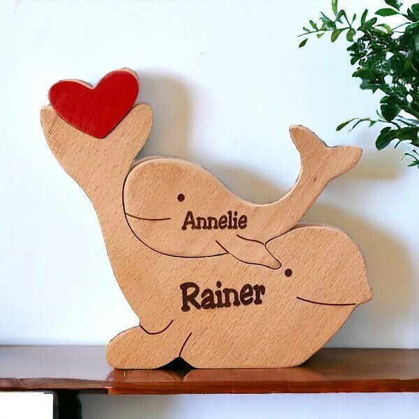 Personalised delphine family wooden puzzle for two people with custom names and a red heart on shelf