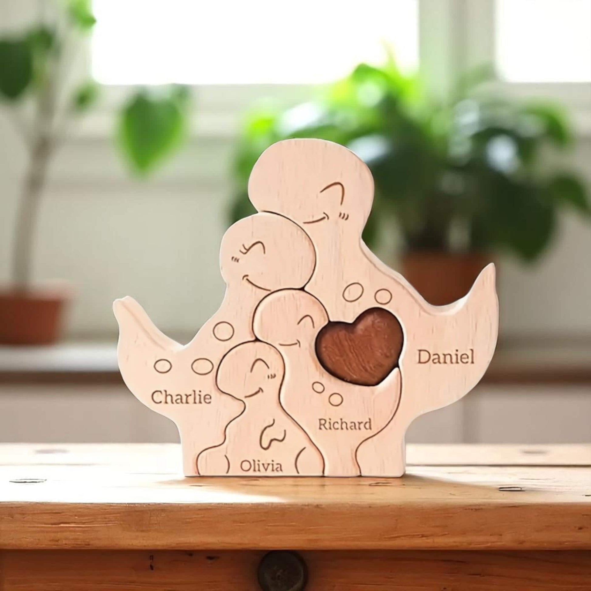 Personalised dinosaur family wooden puzzle for 4 people with custom engraved names on a wooden shelf.
