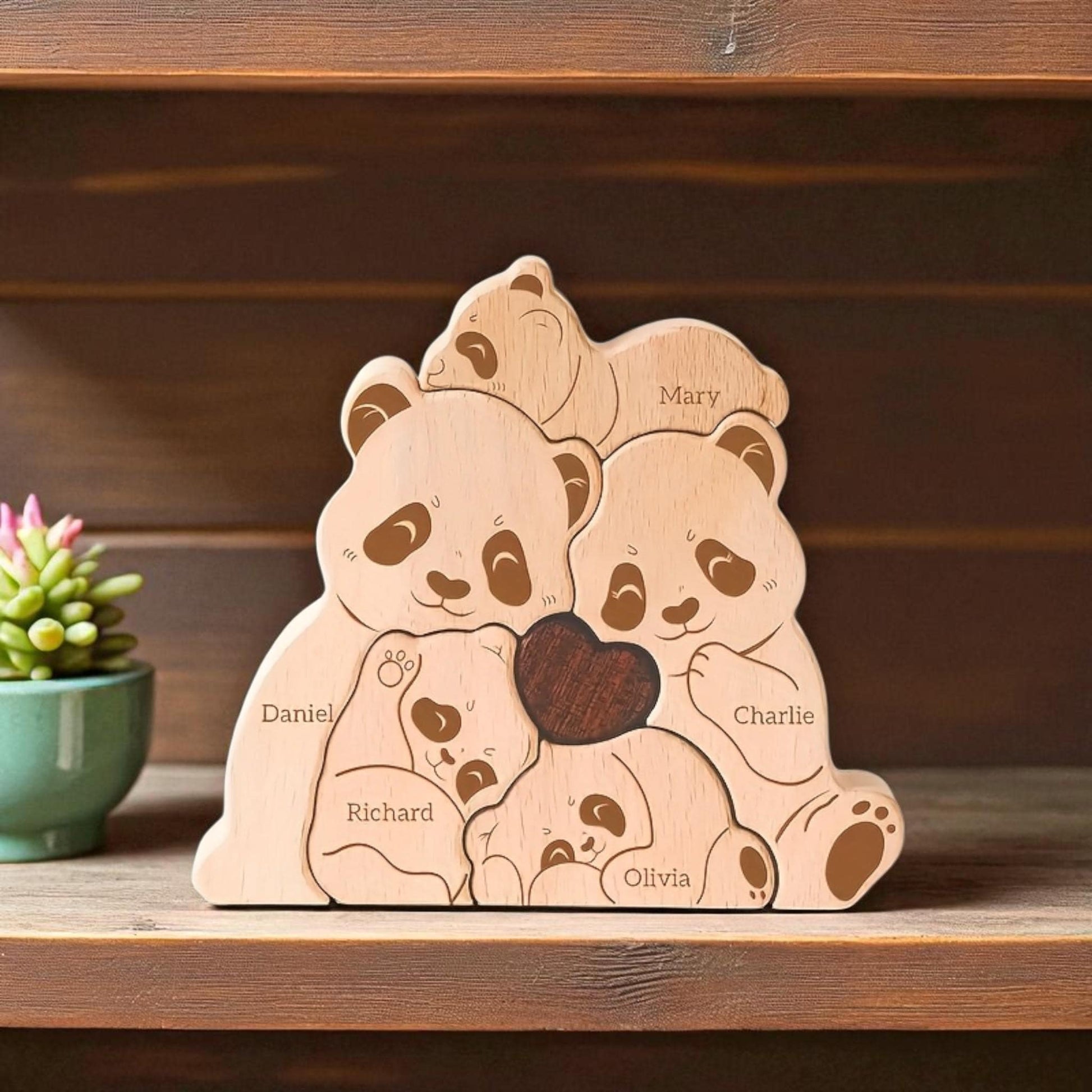 Personalised panda family puzzle for five member family with custom names
on a wooden shelf.