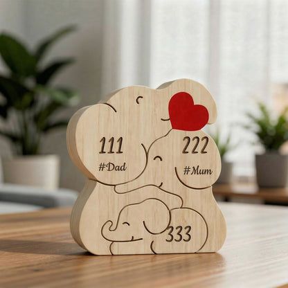 Personalized wooden elephant family figurine with engraved names and heart detail, a meaningful family keepsake and custom gift for parents, children, anniversaries, or home décor.