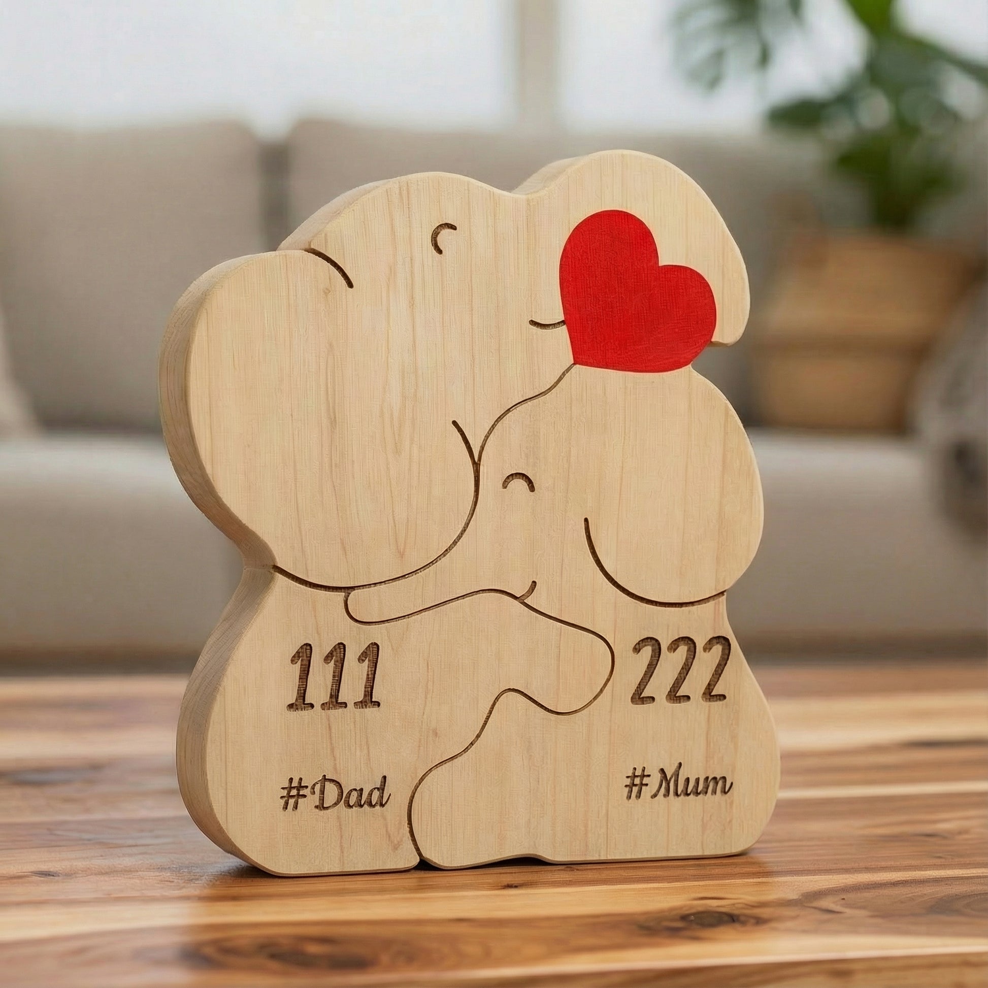 Personalized wooden elephant family for a couple, it is an elephant figurine with engraved names and heart detail, a meaningful family keepsake and custom gift for parents, children, anniversaries, or home décor.