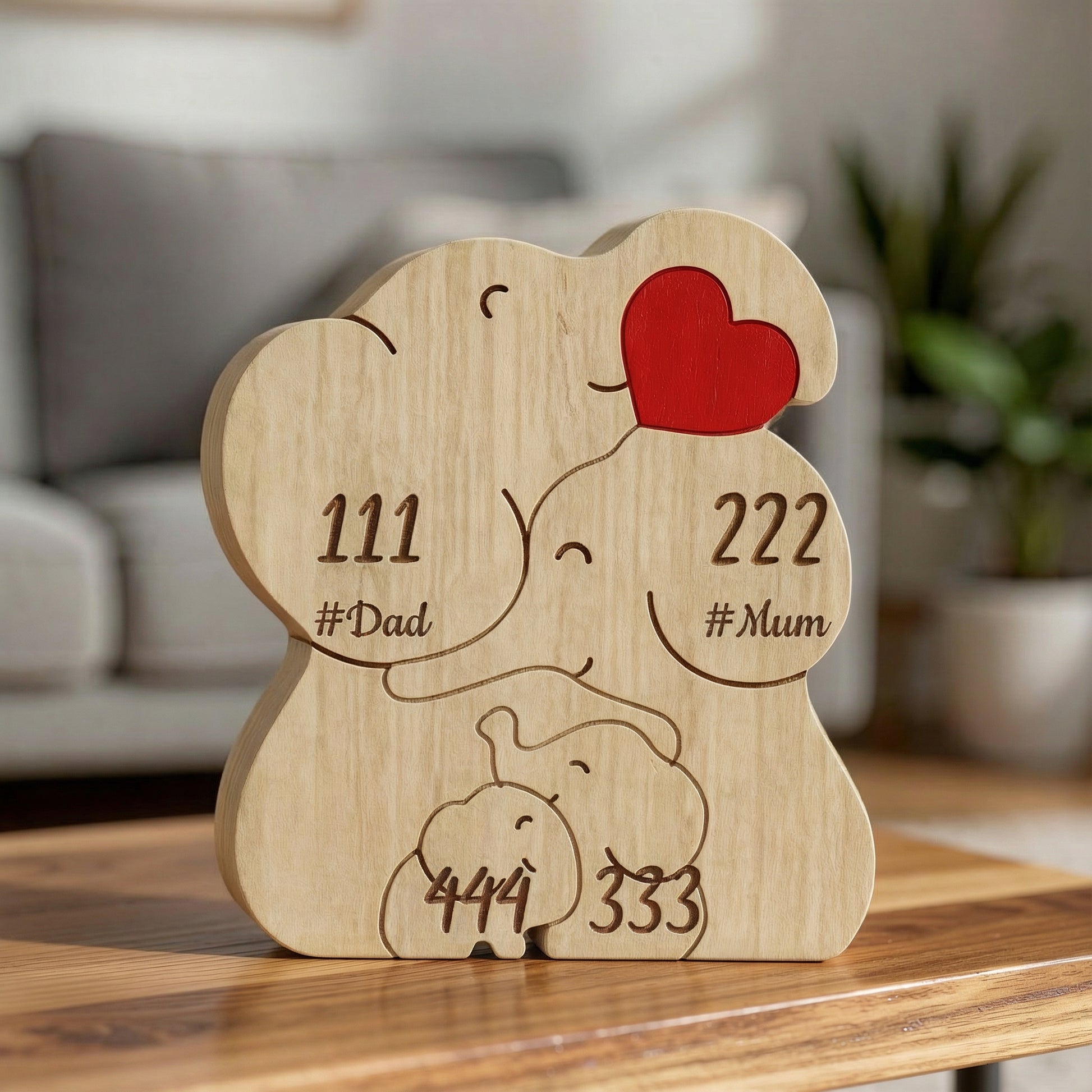 Personalised wooden elephant family puzzle for a family of 4 with engraved names and heart detail, a meaningful family keepsake and custom gift for parents, children, anniversaries, or home décor.