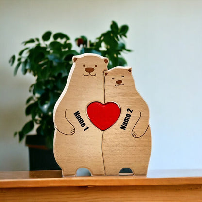Wooden bear figurines for couple with a red heart and customizable names on a wooden surface.
