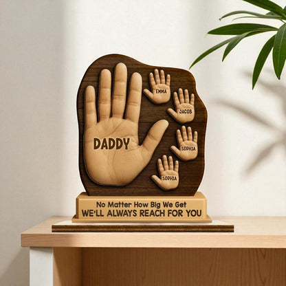 Wooden hand-shaped plaque with engraved names and message on a wooden stand. Wooden dad handprint plaque gift for Father's Day or anniversary present