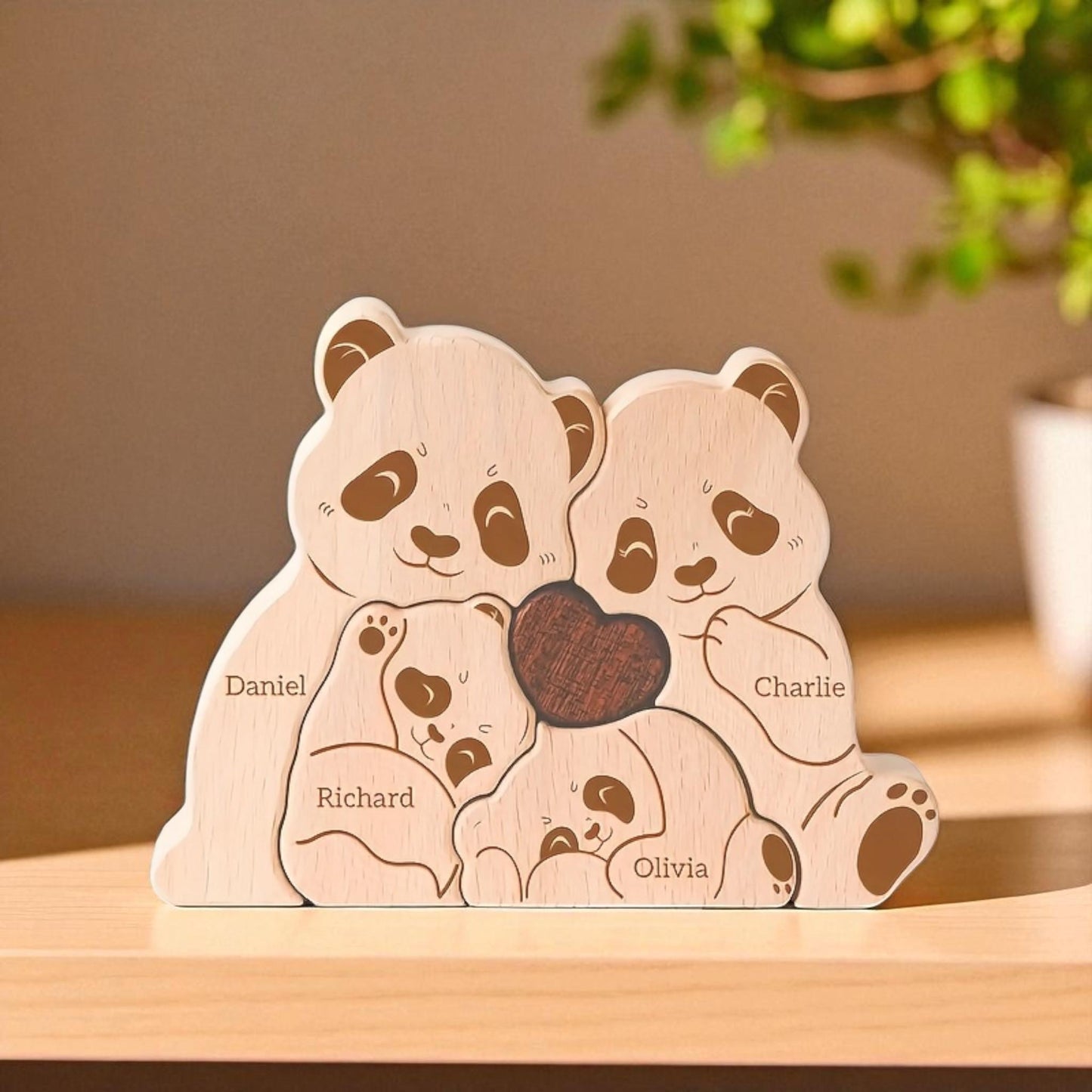 Wooden panda family keepsake four piece puzzle in premium pine wood on a wooden surface.