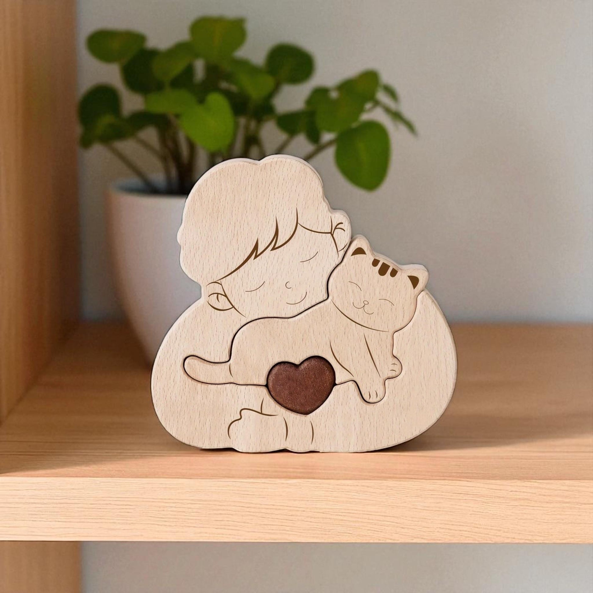 Wooden figurine of a boy hugging a cat with a heart, on a wooden shelf.